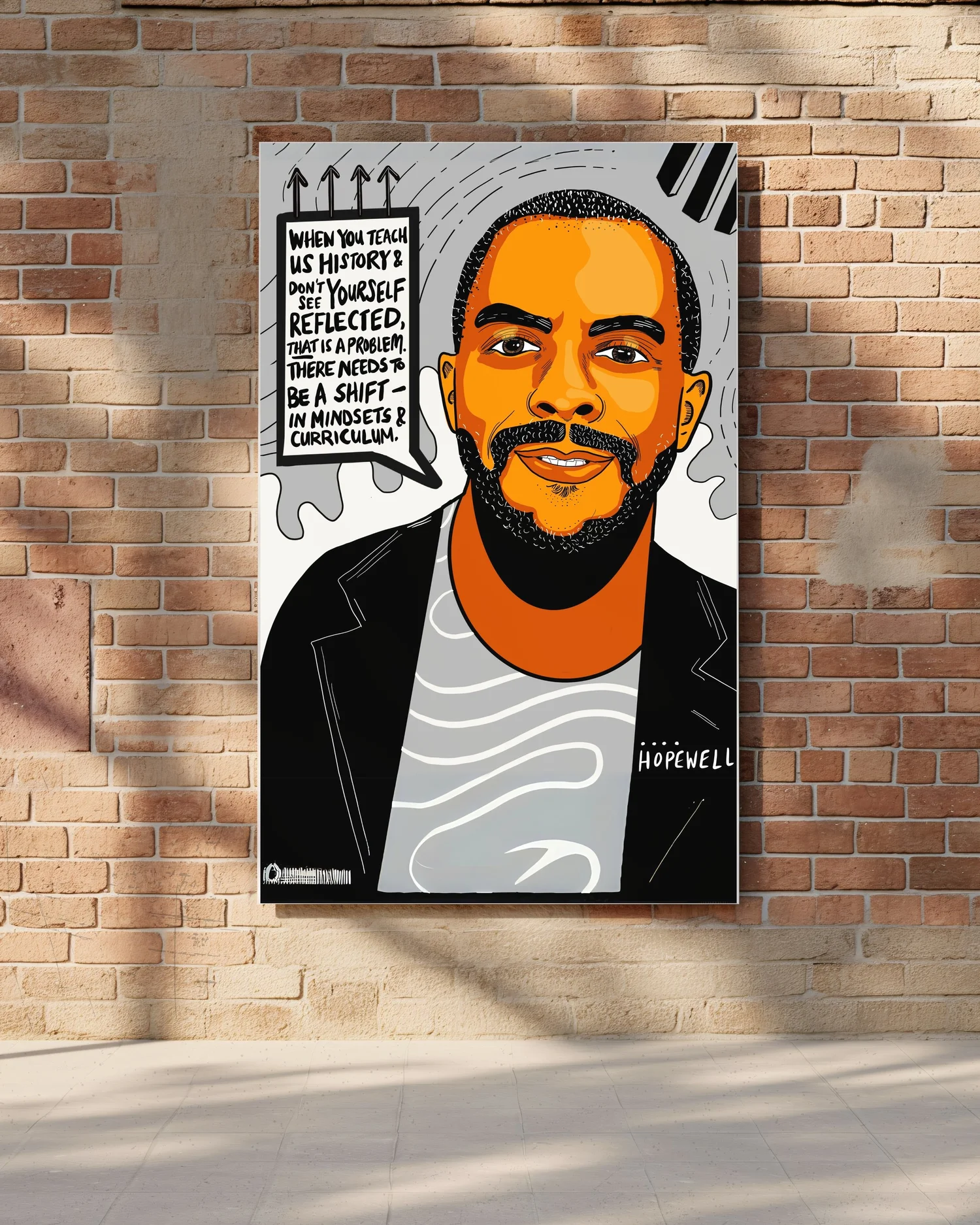Bold black-and-white mural portrait of a bearded man pasted on a brick wall